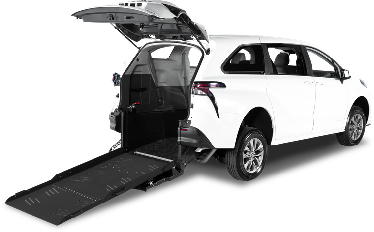 Toyota Sienna Rear Entry in profile, tailgate raised and the ramp folded out onto the ground behind it.